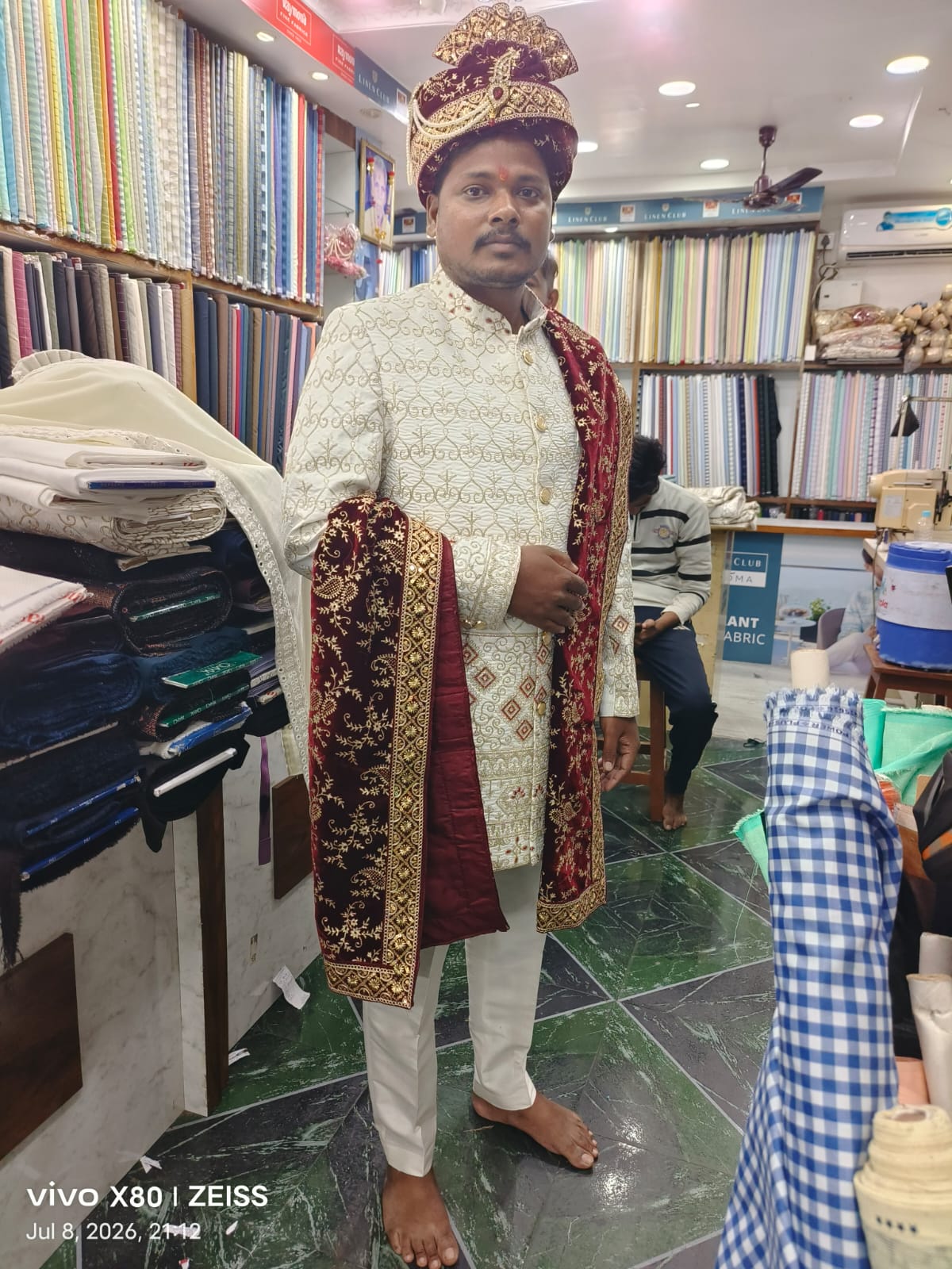 Groom sherwani with maroon embroidered stole and turban